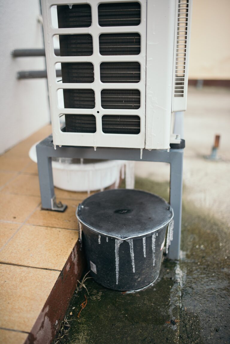 File:Water dripping from an air conditioning unit onto a black container at a residential property during a hot summer day.jpg